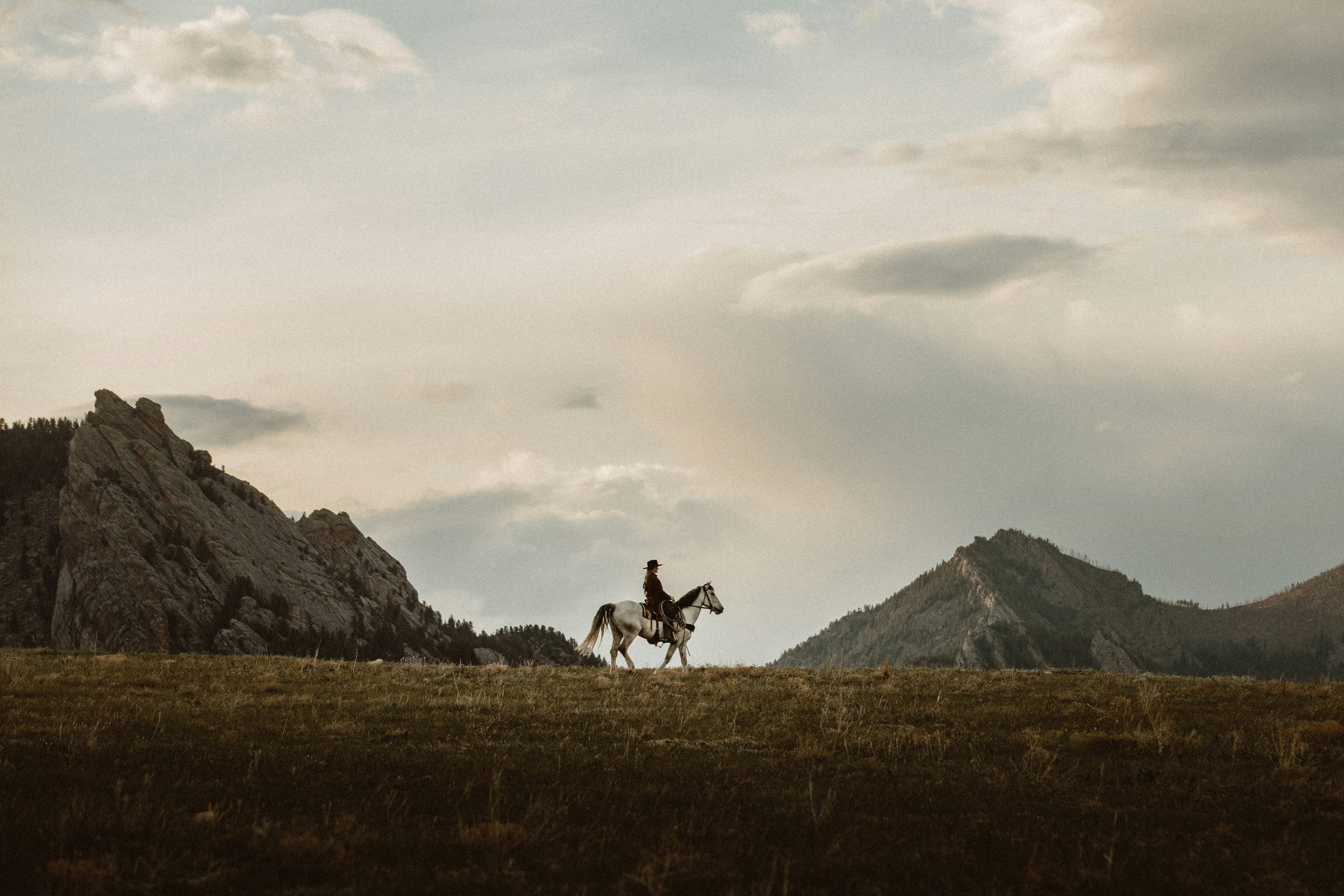 A beautiful western backdrop with a cowgirl. By Taylor Brandon.